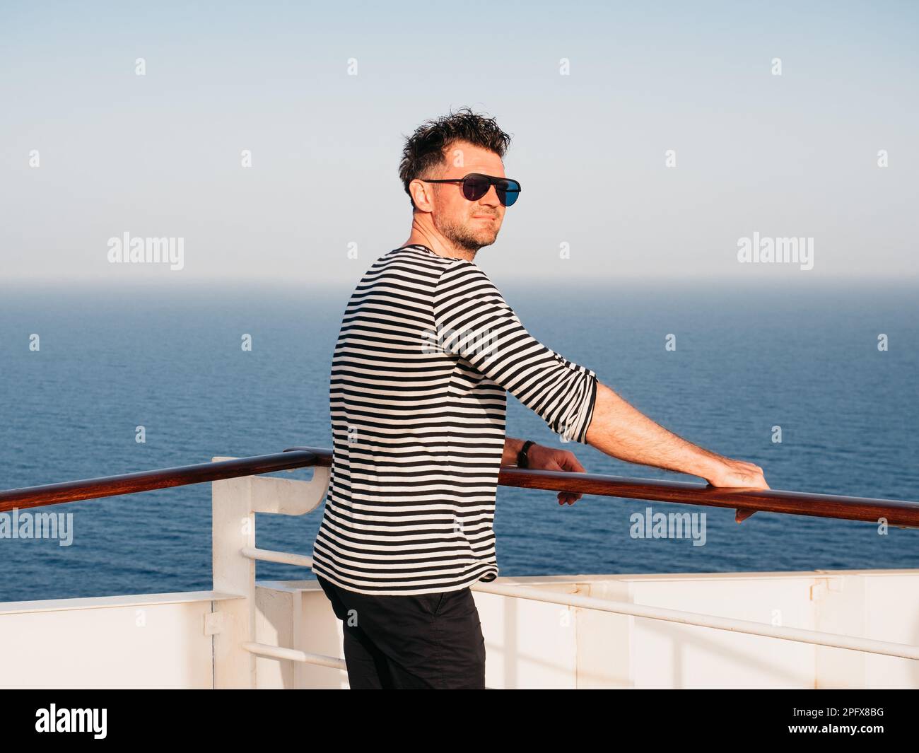 Man standing on ship deck hi-res stock photography and images - Alamy