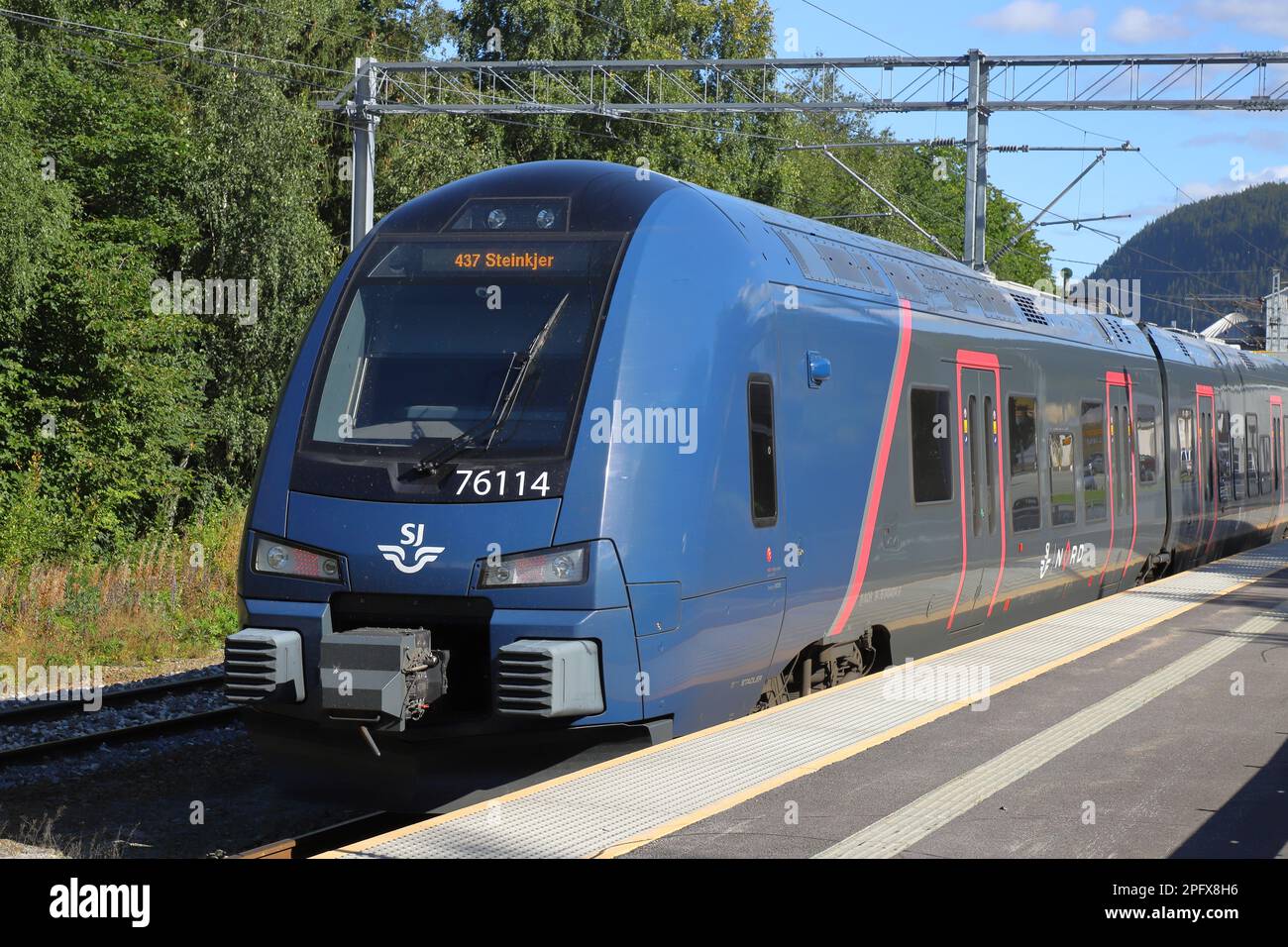 Lundamo, Norway - September 2, 2022: Commuter train type 76 operated by SJ Nord at the Lundamo railroad station. Stock Photo