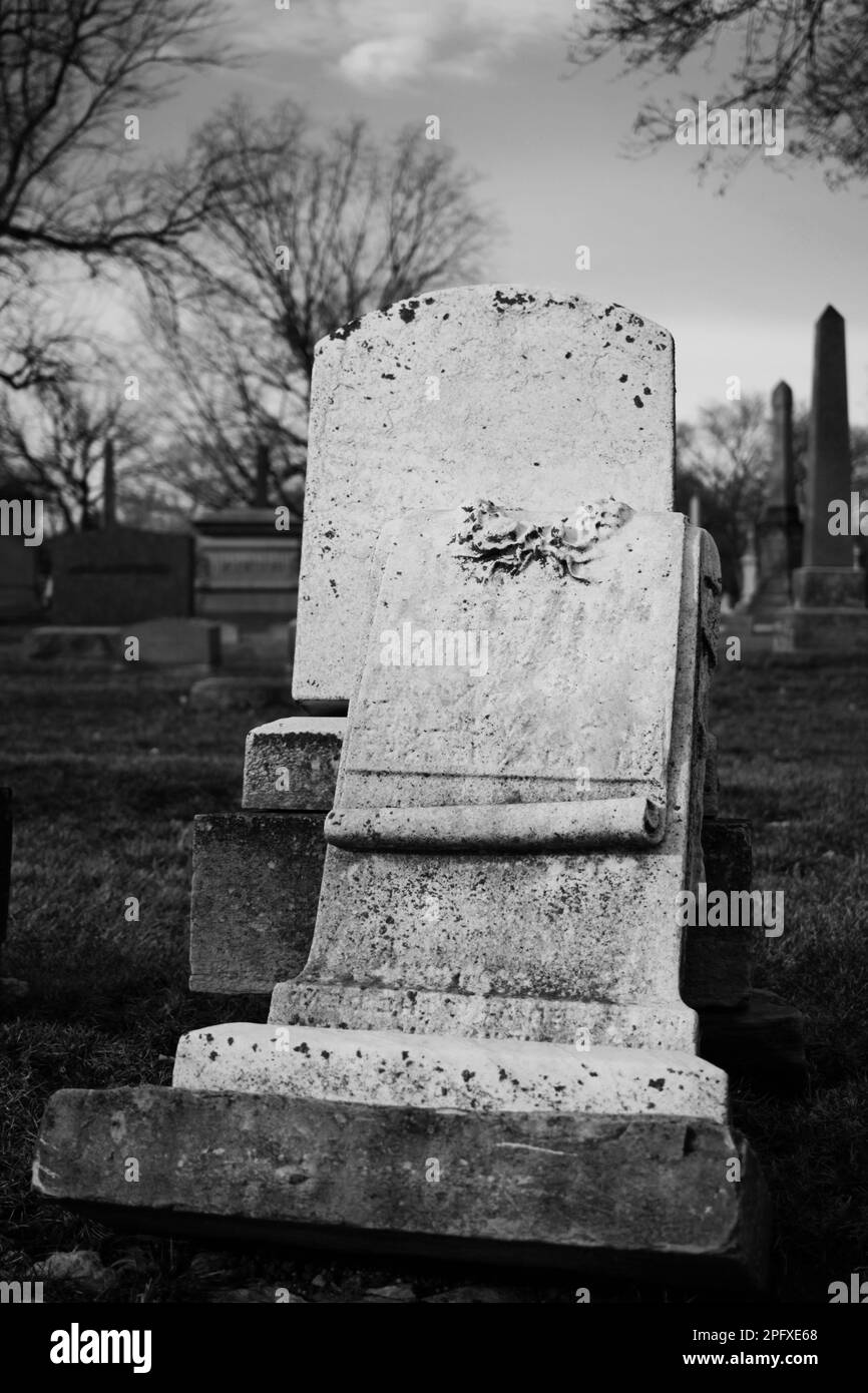 Worn and weathered vintage headstone with a blank epitaph and room for