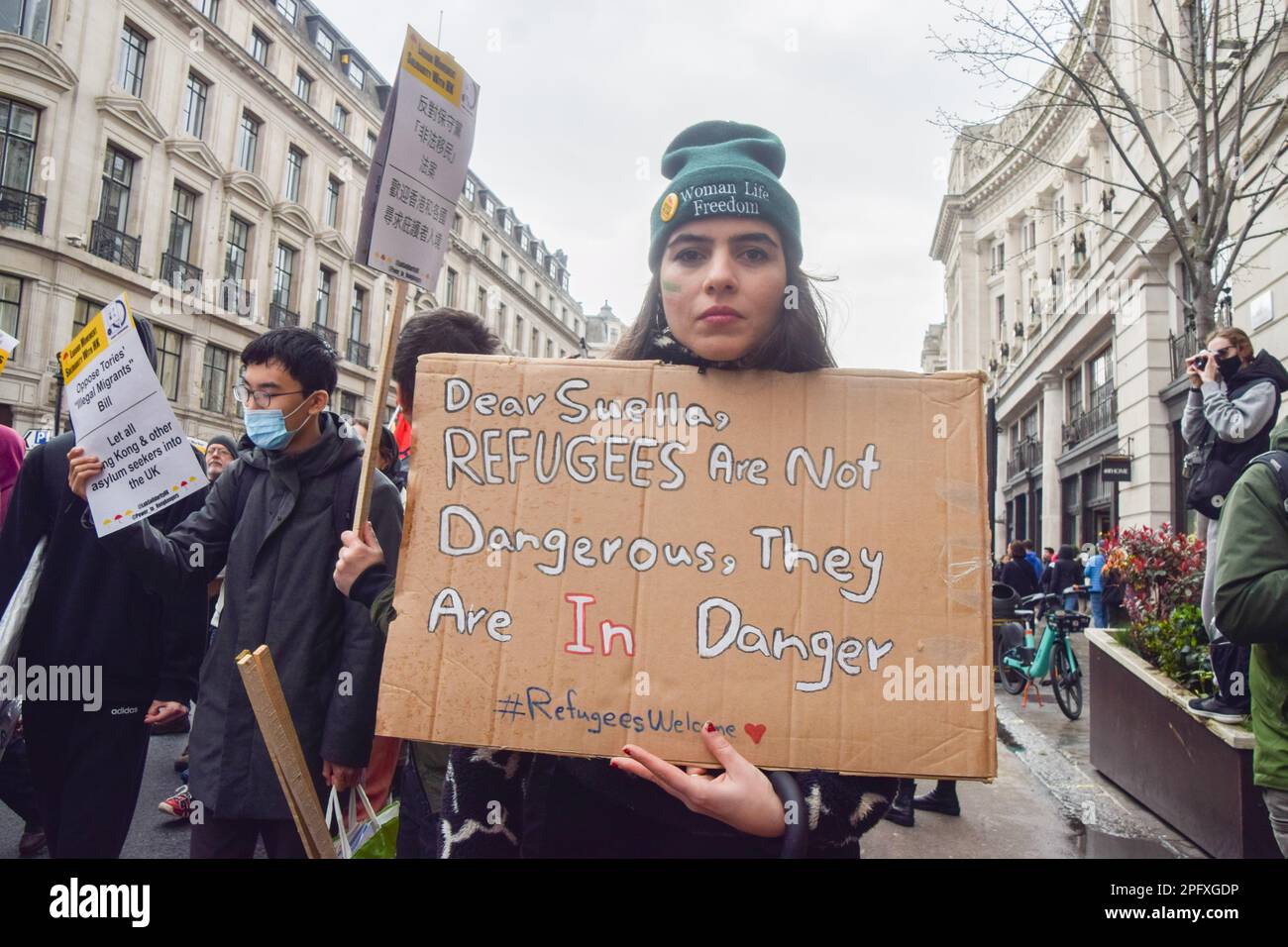 London, UK. 18th March 2023. Protesters in Regent Street. Thousands of people marched from BBC headquarters through Central London in support of refugees, and in protest against racism and the UK Government's Illegal Migration Bill. Stock Photo