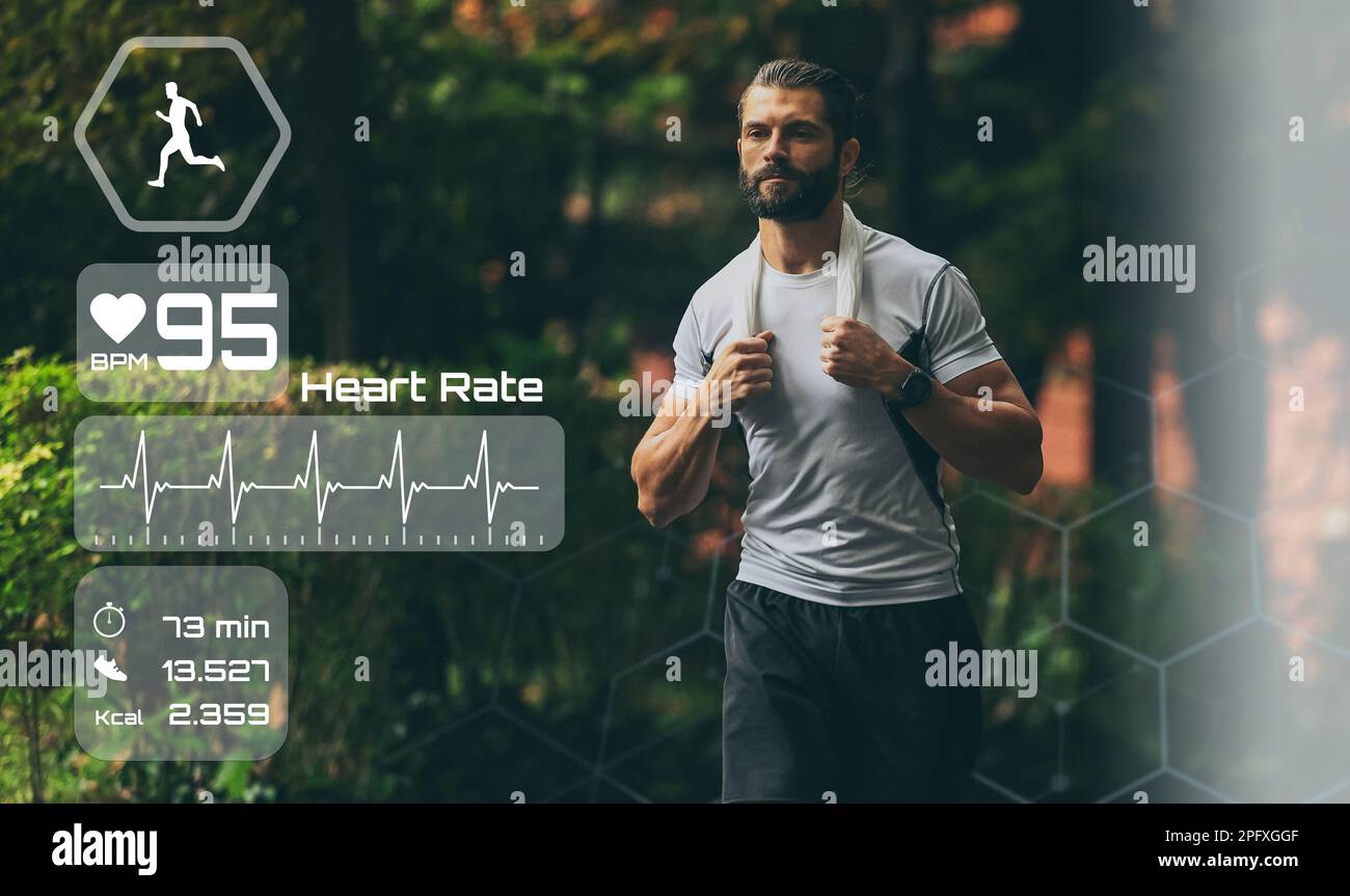 Man running in the park. Healthy runner with smart fit watch