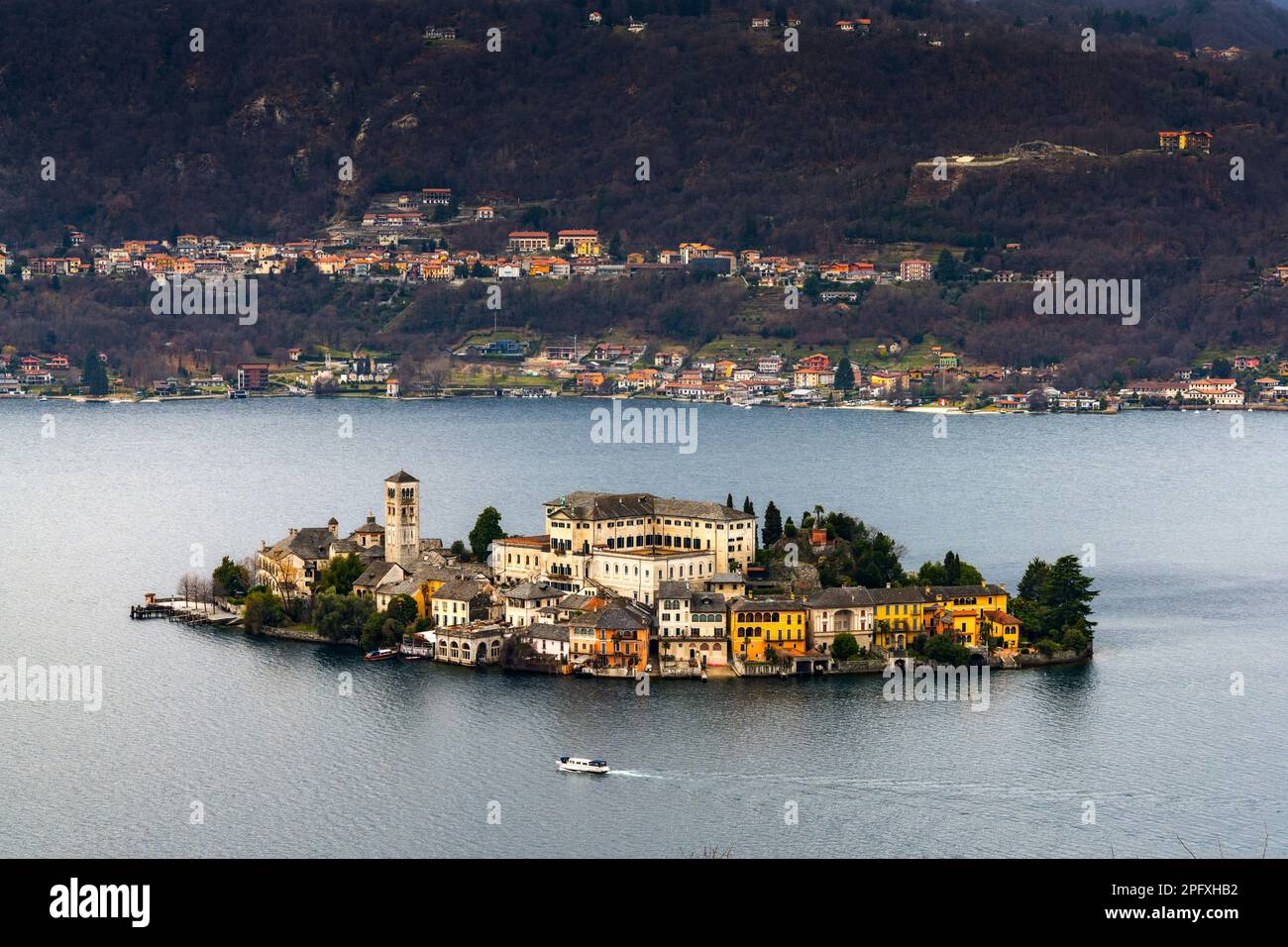 Orta San Giulio, Italy - 13 March, 2023: view of Lake Orta and the Isola San Guilio islet with its historic buildings Stock Photo