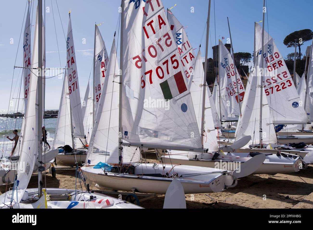 SAN TERENZO, LERICI, ITALY - MARCH 10, 2023: San Terenzo beach, crowded with sailboats before the regatta in spring. Lerici, in the Gulf of La Spezia, Stock Photo