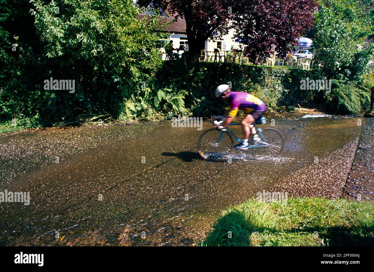 Somerset England Winsford Exmoor Man Cycling Through Ford Stock Photo ...