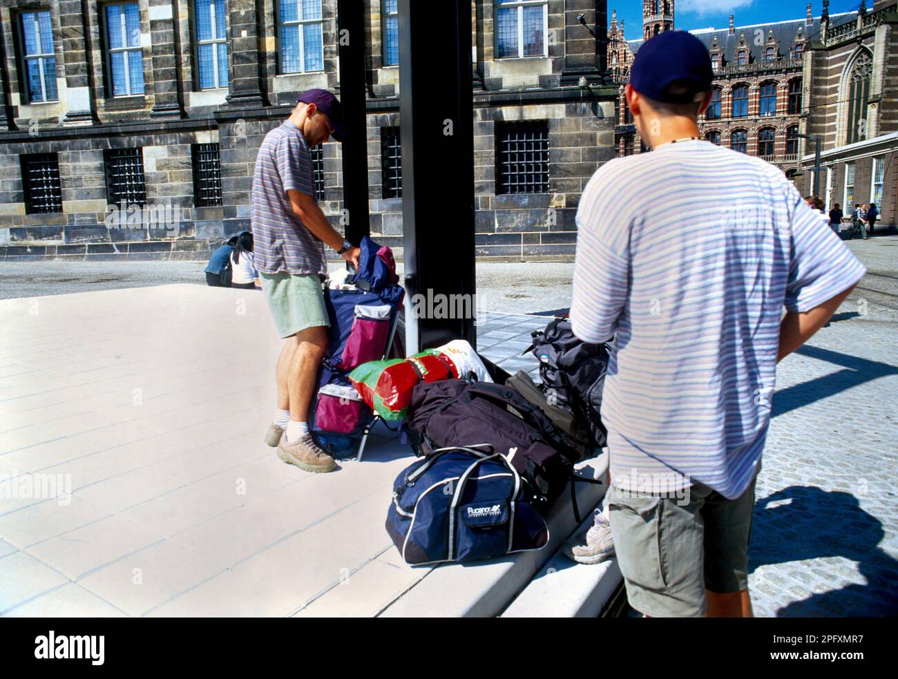 Amsterdam Holland Teenage Male Backpackers Wearing Baseball Caps Stock Photo