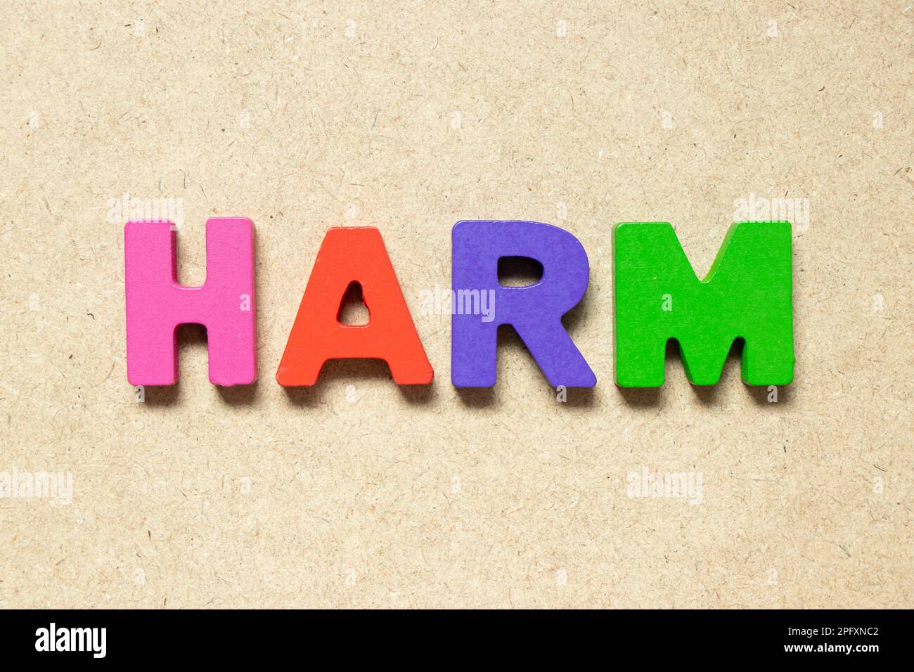 Color alphabet letter in word harm on wood background Stock Photo - Alamy