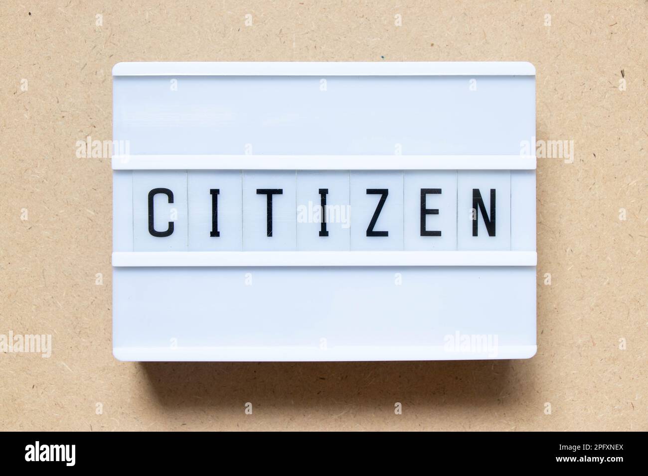 Lightbox with word citizen on wood background Stock Photo