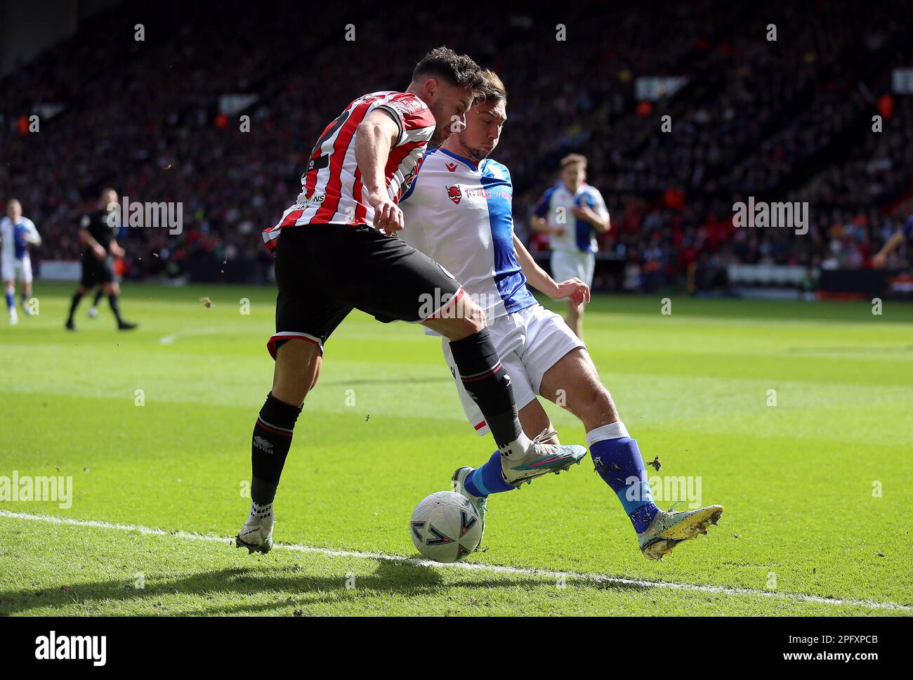 Sheffield United's George Baldock and Blackburn Rovers' Harry Pickering during the Emirates FA Cup quarter final match at Bramall Lane, Sheffield. Picture date: Sunday March 19, 2023. Stock Photo