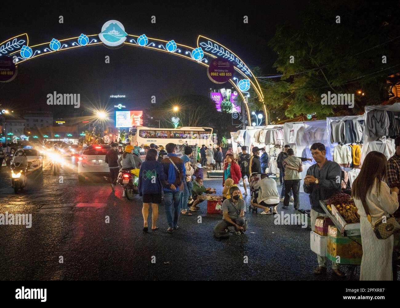 A general view of people and traffic at the night market in Dalat, Vietnam. Stock Photo