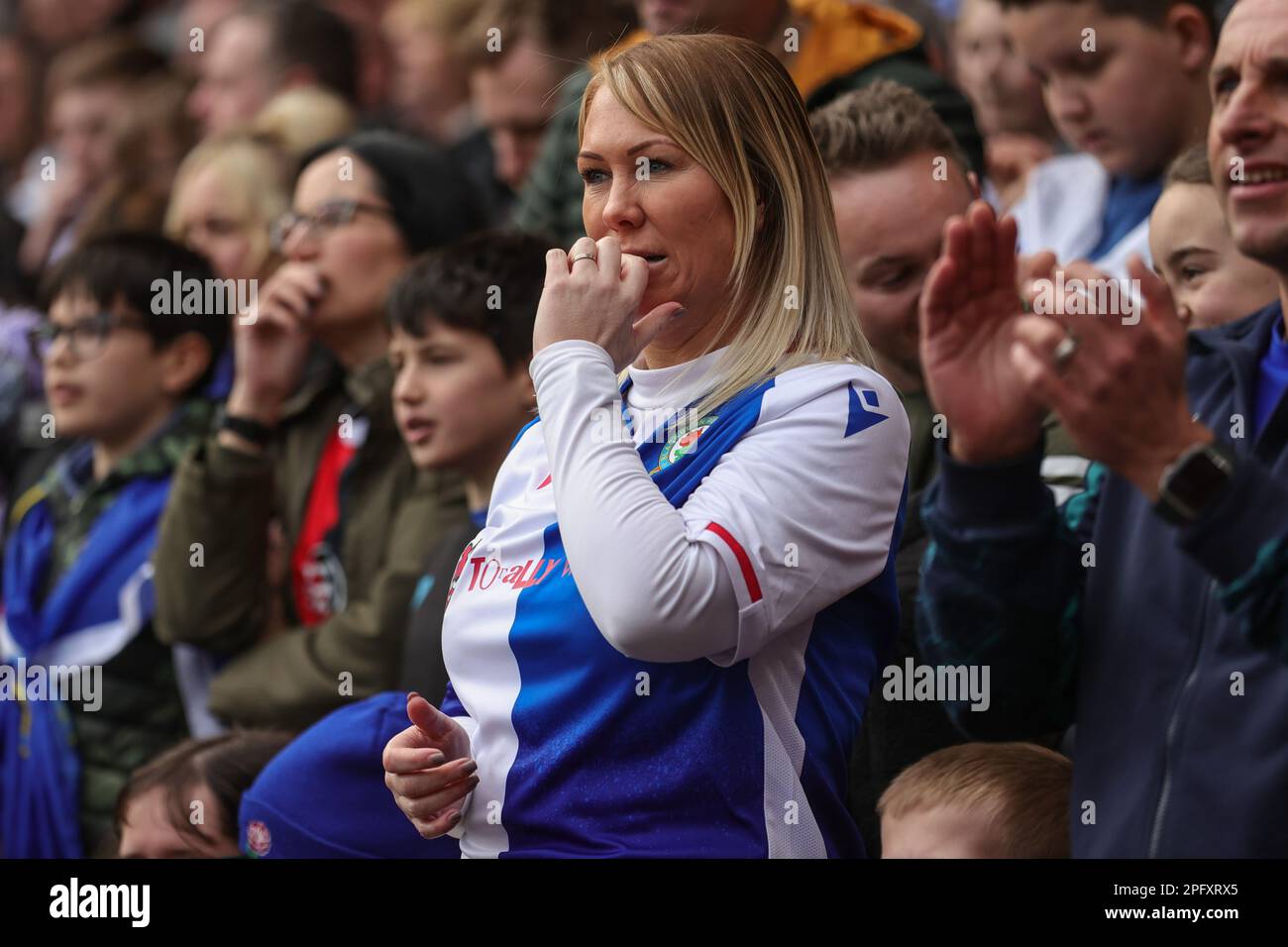 A Blackburn Rovers fan bites her nails during the Emirates FA Cup  Quarter-Finals Sheffield United vs Blackburn Rovers at Bramall Lane,  Sheffield, United Kingdom, 19th March 2023 (Photo by Mark Cosgrove/News  Images