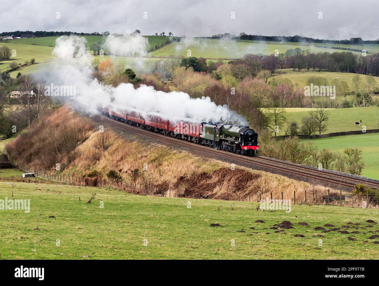 Steam locomotive 'Scots Guardsman' with The Winter Cumbrian Mountain Express special at Armathwaite, Cumbria, on the Settle-Carlisle line, March 2023. Stock Photo