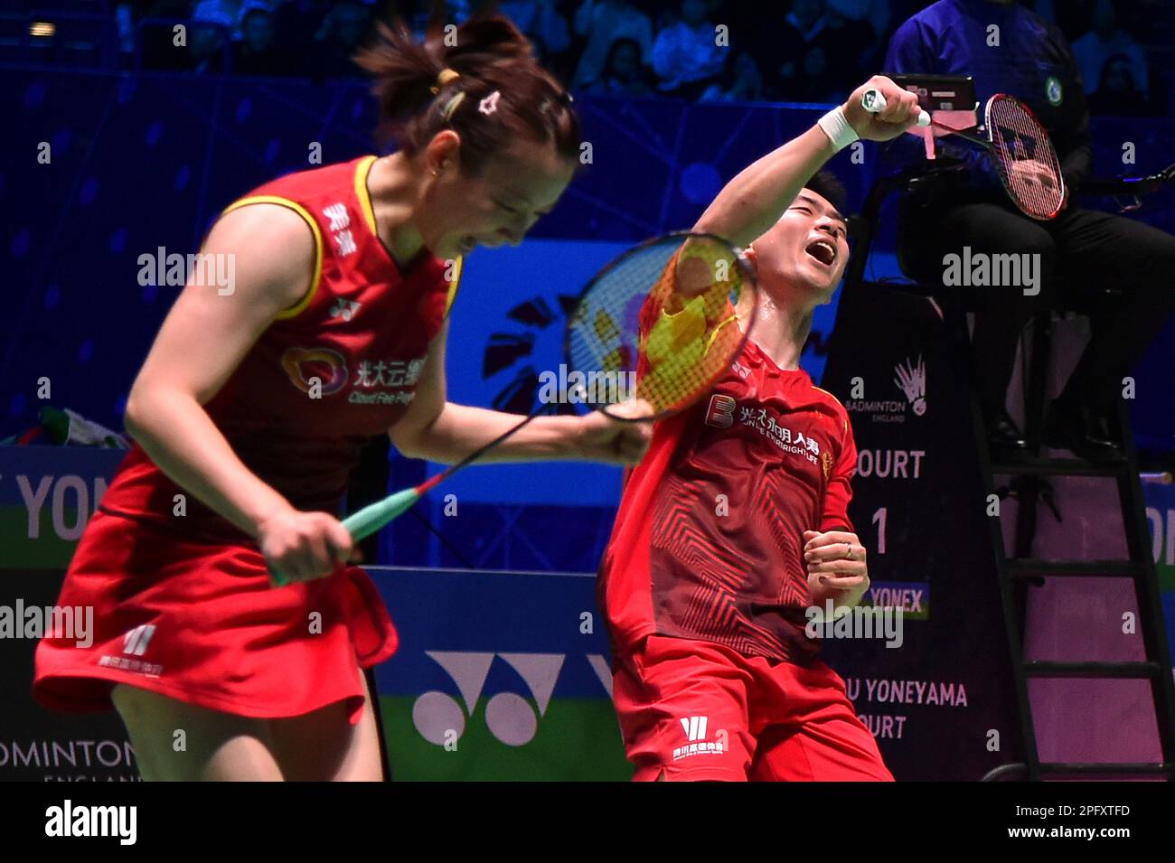 Chinas Zheng Si Wei, right, and Huang Ya Qiong react after winning their mixed double final match against Koreas Seo Seung Jae and Chae Yu Yung in the All England Open Badminton