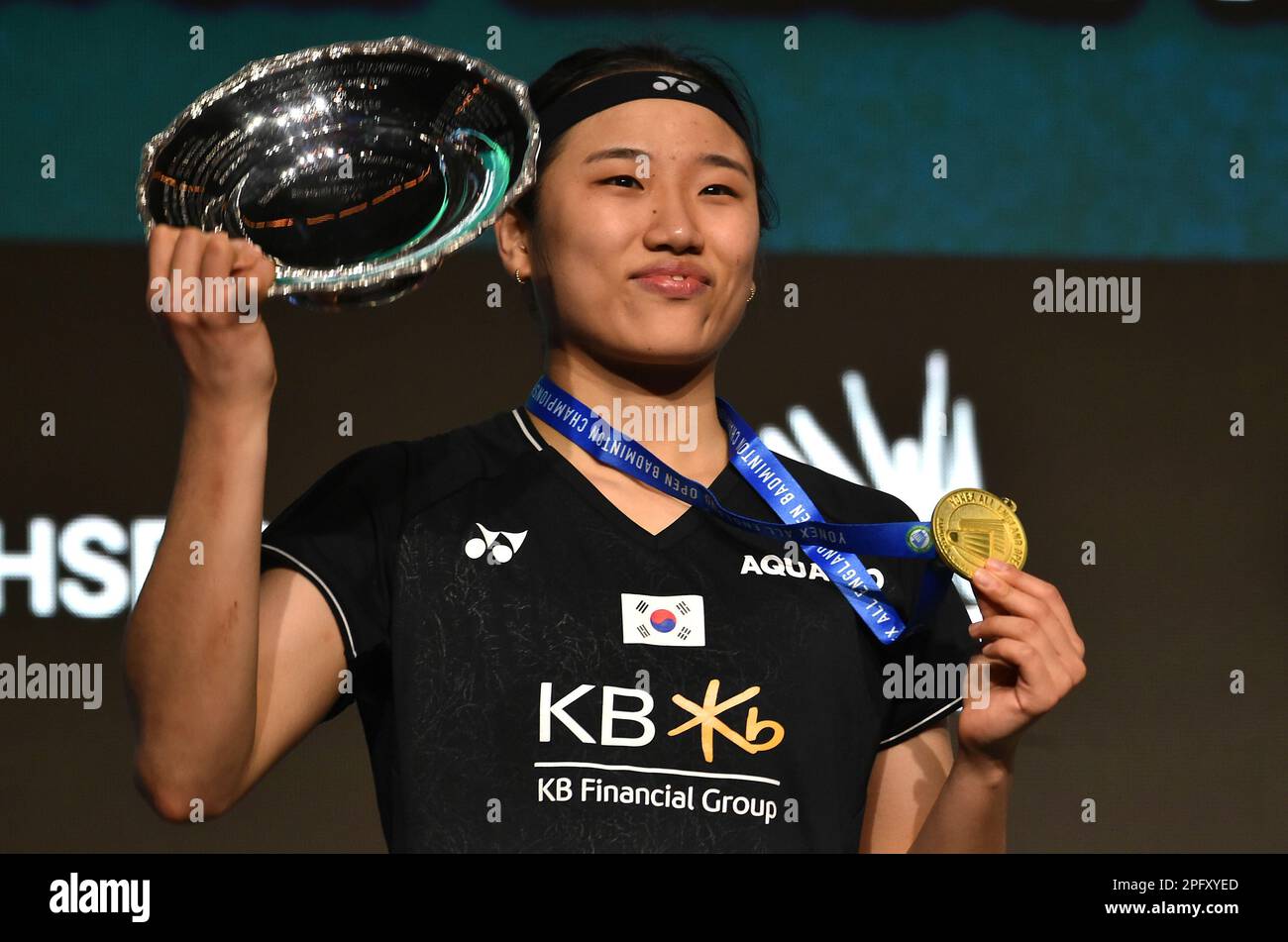 Koreas An Se Young poses with trophy after winning the womens final match against Chinas Chen Yu Fei in the All England Open Badminton Championships at the Utilita Arena in Birmingham, England,