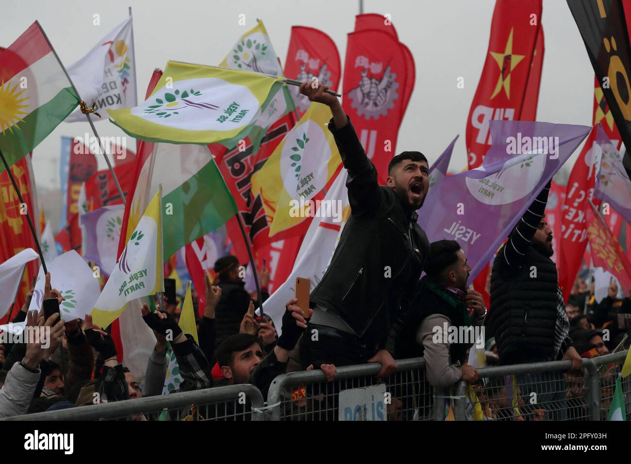 A man waves Green Left Party flags during a rally to celebrate Nowruz, which marks the arrival of spring, in Istanbul, Turkey March 19, 2023. REUTERS/Murad Sezer Stock Photo
