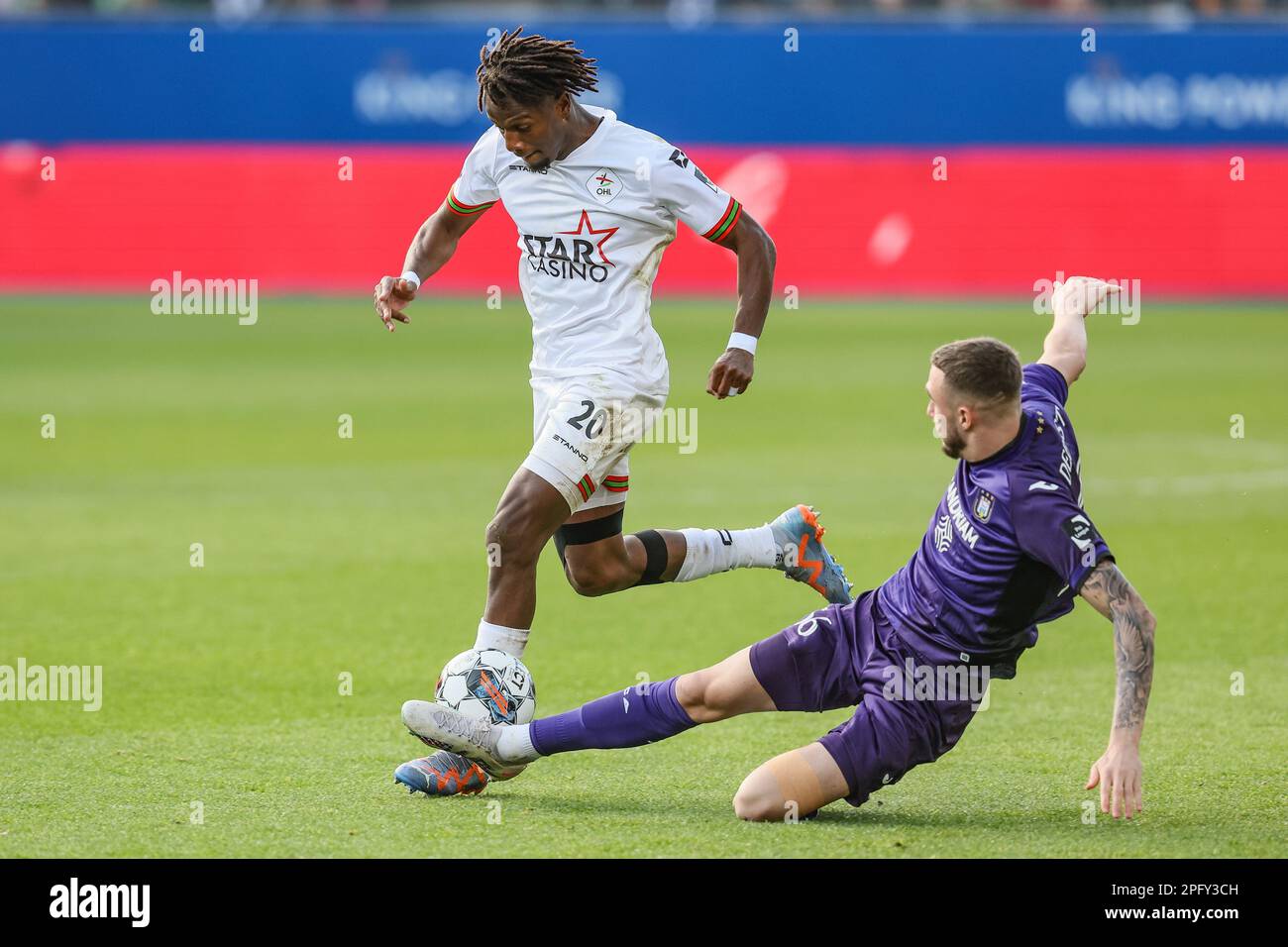 OHL's Hamza Mendyl and Anderlecht's Zeno Debast fight for the ball during a soccer match between Oud-Heverlee Leuven and RSC Anderlecht, Sunday 19 March 2023 in Leuven, on day 30 of the 2022-2023 'Jupiler Pro League' first division of the Belgian championship. BELGA PHOTO BRUNO FAHY Stock Photo
