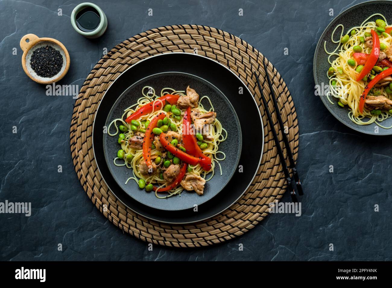 Chicken and edamame beans served with vermicelli noodles, ready for
