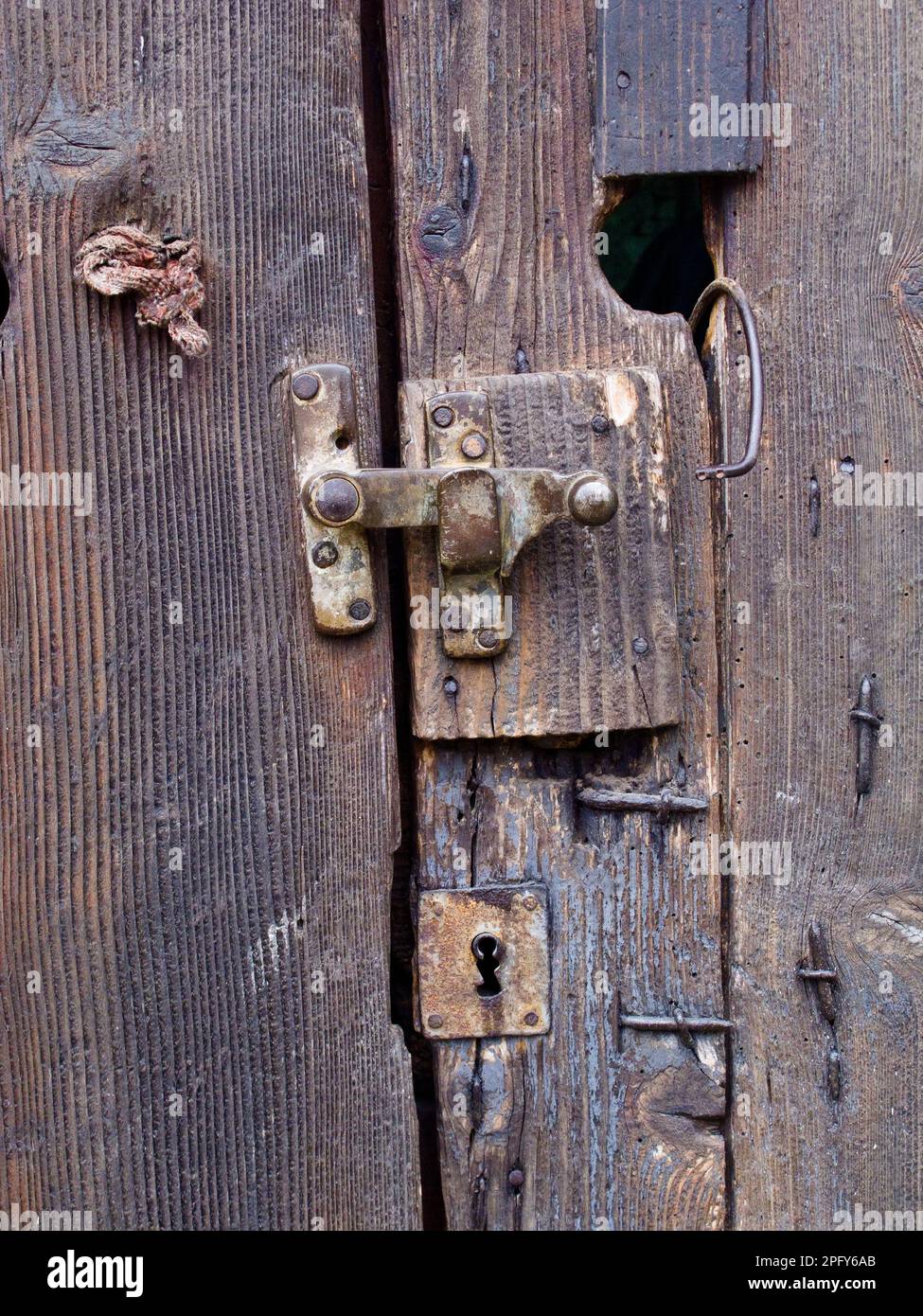 Locks on wooden barn door, Fermes Equestres du Vercors, Sassenage, Grenoble Stock Photo