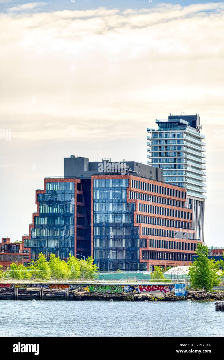 25 Kent Avenue is a full-block mid-rise commercial development in North Williamsburg. The stepped, brick-faced blocks have glass end caps. Stock Photo