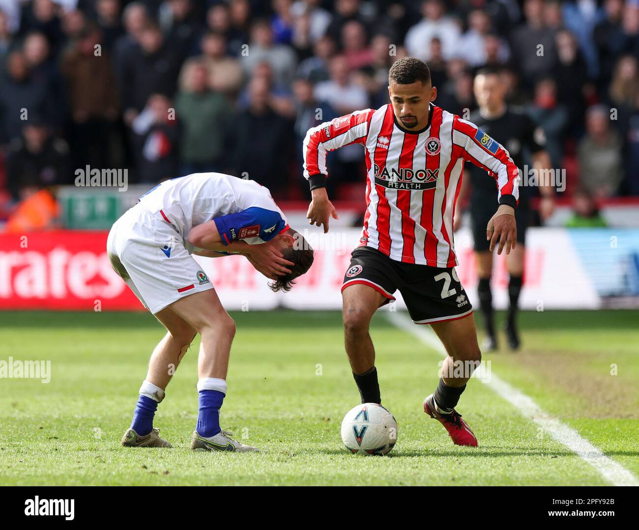 Bramall Lane, Sheffield, UK. 19th Mar, 2023. FA Cup Football, Quarter Final, Sheffield United versus Blackburn Rovers; Blackburn Rovers' Tyler Morton holds his face after a challenge from Sheffield United's Iliman Ndiaye Credit: Action Plus Sports/Alamy Live News Stock Photo