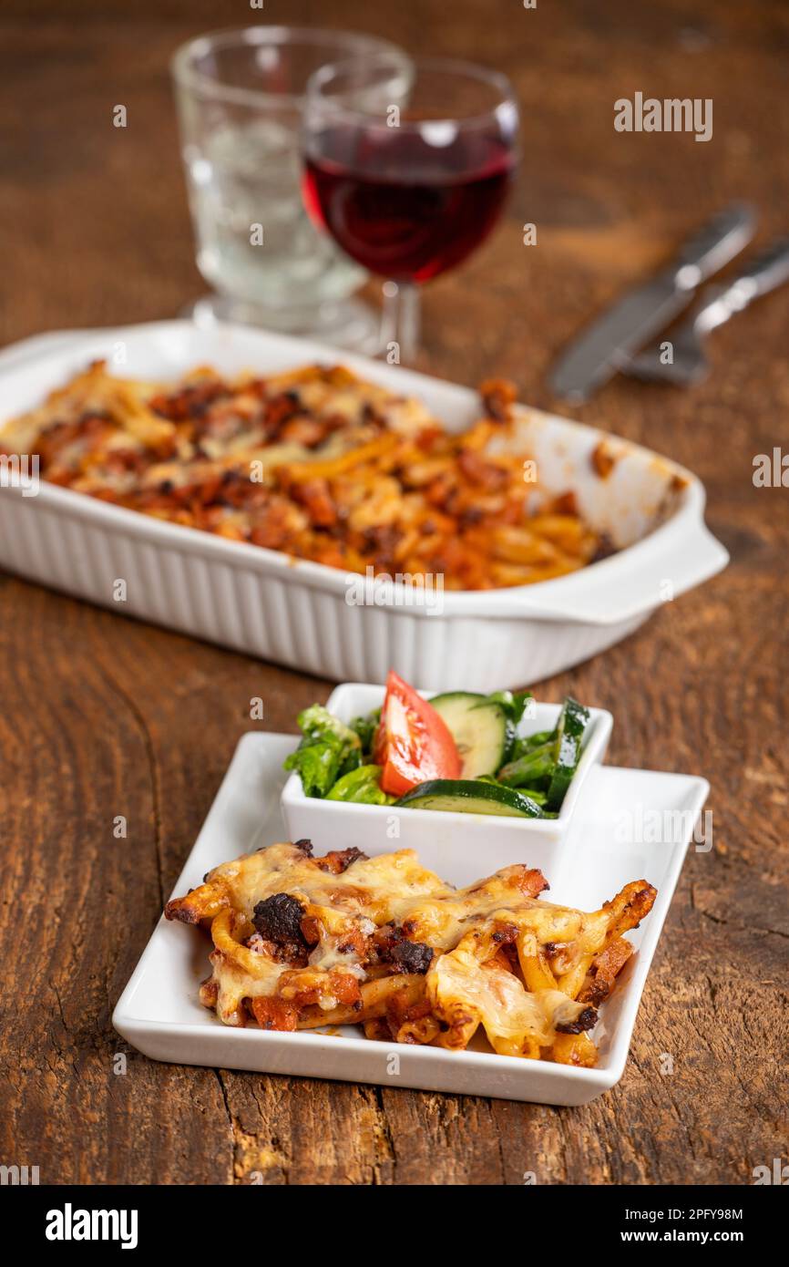 rigatoni al forno on wood Stock Photo