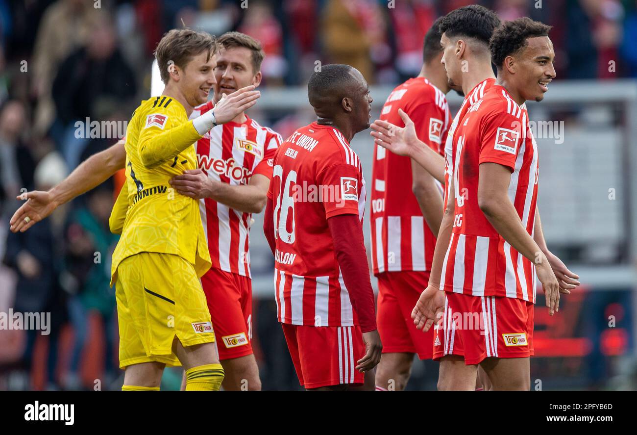 Berlin, Germany. 19th Mar, 2023. Soccer: Bundesliga, 1. FC Union Berlin - Eintracht Frankfurt, Matchday 25, An der Alten Försterei. Union's goalkeeper Frederik Rönnow (l) gossips with teammates after the win. Credit: Andreas Gora/dpa - IMPORTANT NOTE: In accordance with the requirements of the DFL Deutsche Fußball Liga and the DFB Deutscher Fußball-Bund, it is prohibited to use or have used photographs taken in the stadium and/or of the match in the form of sequence pictures and/or video-like photo series./dpa/Alamy Live News Stock Photo