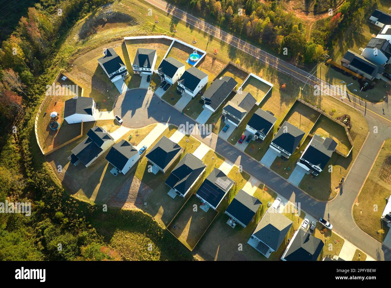 Aerial view of cul de sac at neighbourhood road dead end with densely