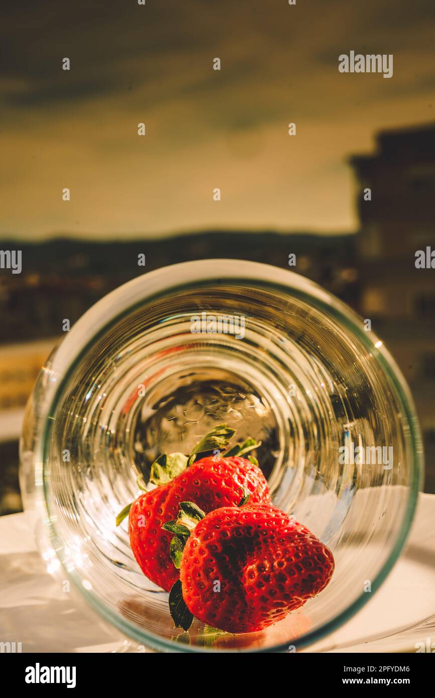strawberries in a glass container Stock Photo - Alamy