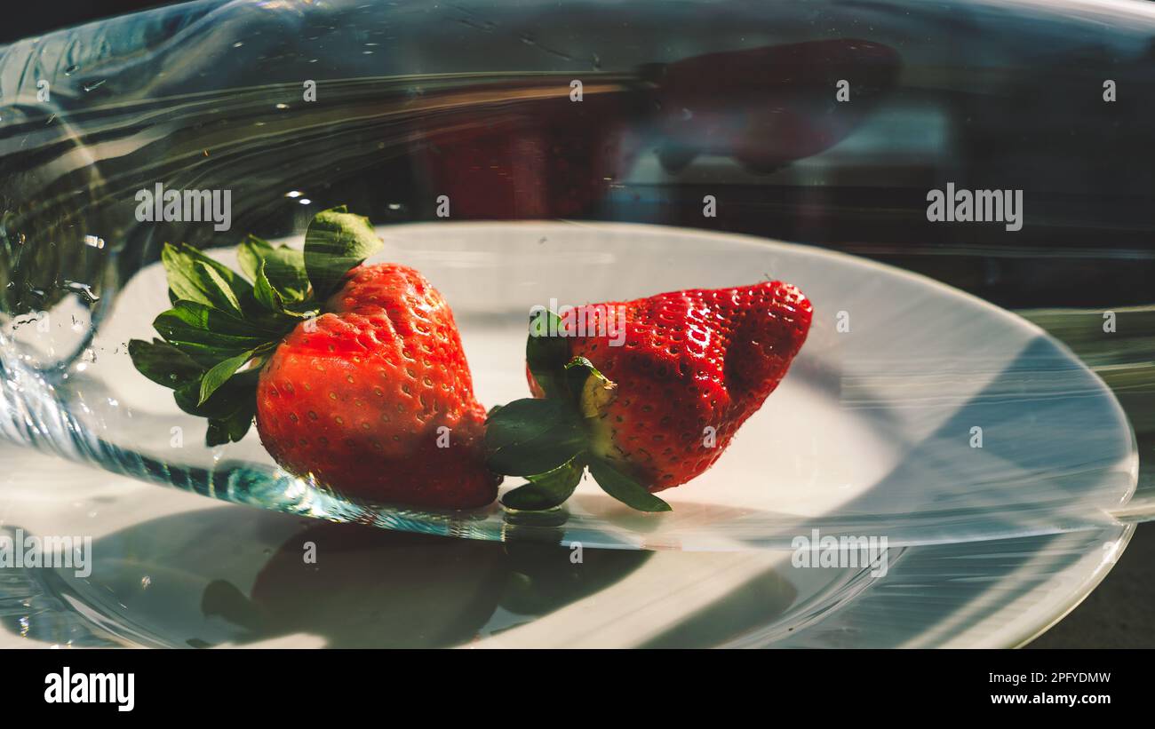strawberries in a glass container Stock Photo - Alamy
