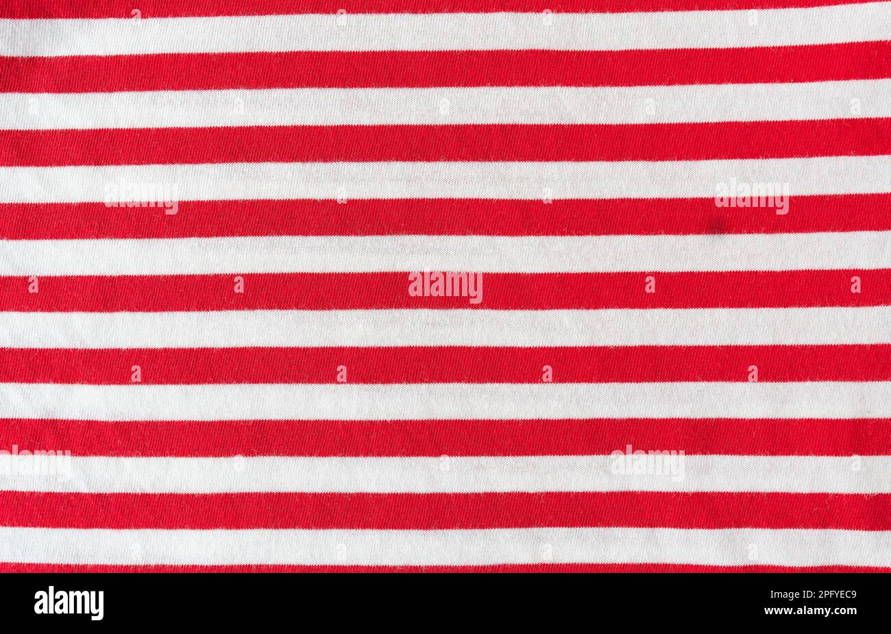 Fabric sample in red white horizontal stripe with worked. Background