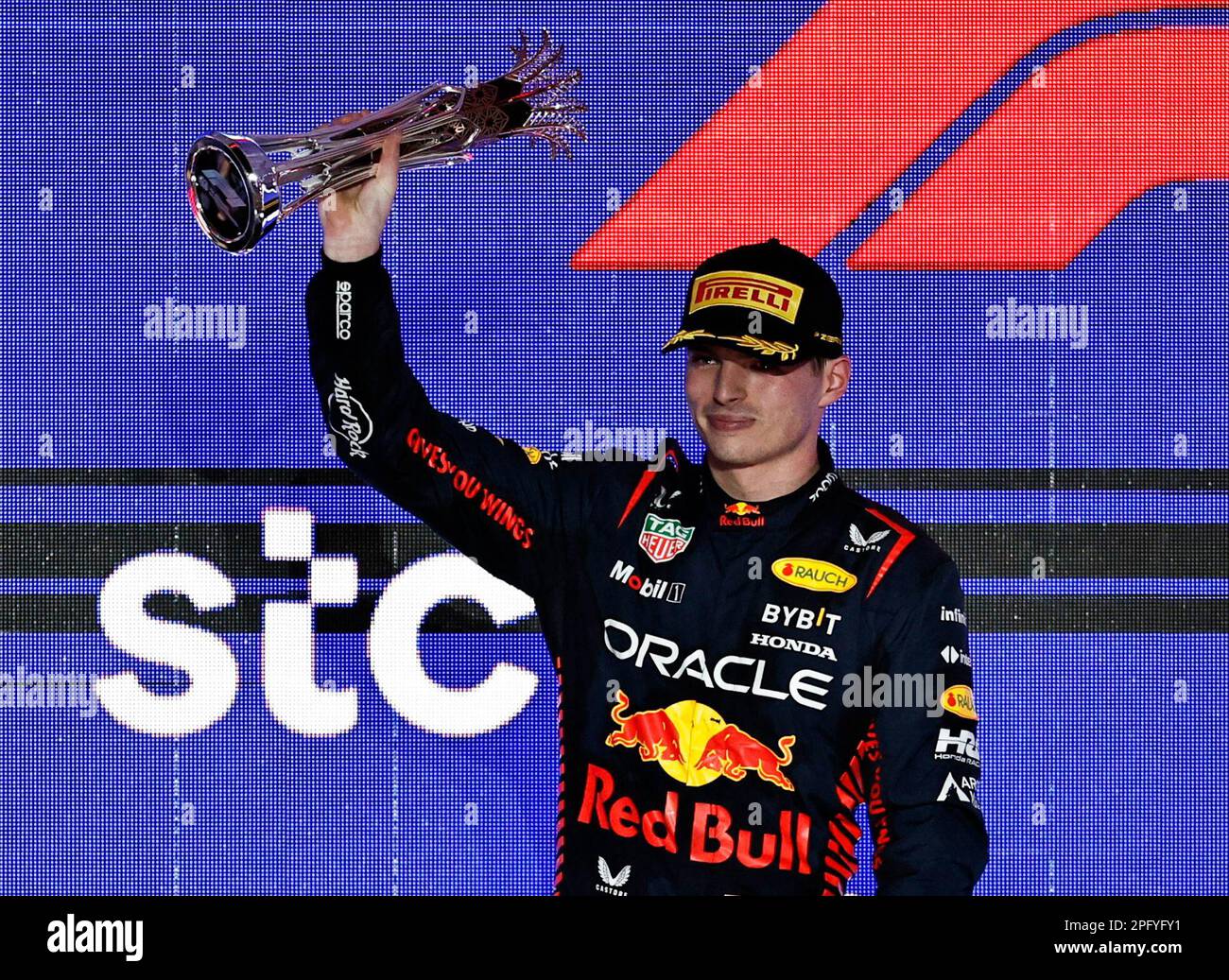 Formula One F1 - Saudi Arabian Grand Prix - Jeddah Corniche Circuit, Jeddah, Saudi Arabia - March 19, 2023 Red Bull's Max Verstappen celebrates with a trophy on the podium after finishing second place in the Saudi Arabian Grand Prix REUTERS/Hamad I Mohammed Stock Photo