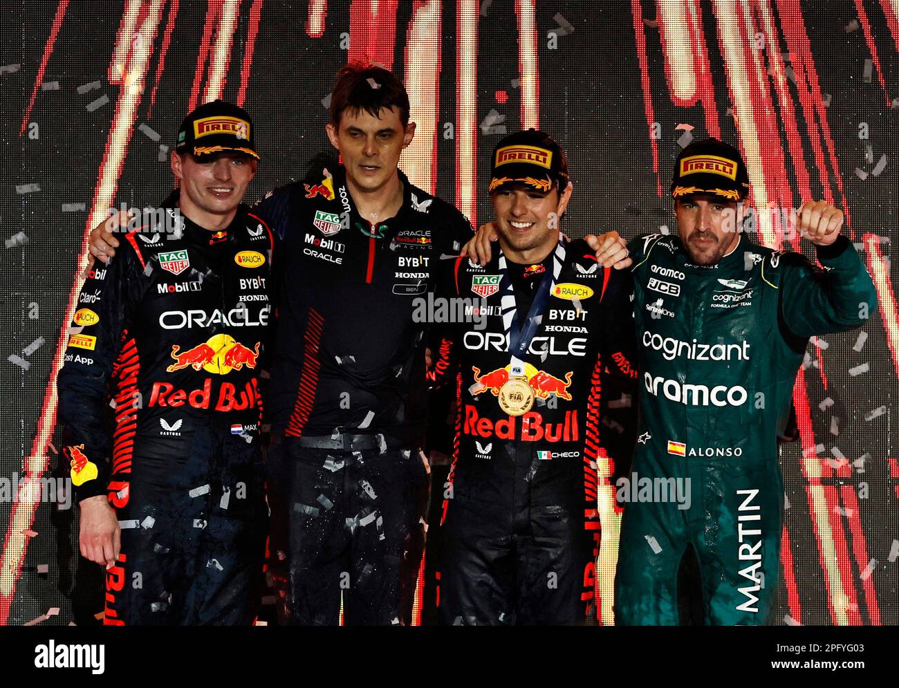 Formula One F1 - Saudi Arabian Grand Prix - Jeddah Corniche Circuit, Jeddah, Saudi Arabia - March 19, 2023 Red Bull's Sergio Perez celebrates on the podium after winning the Saudi Arabian Grand Prix alongside second placed Red Bull's Max Verstappen and third placed Aston Martin's Fernando Alonso before he is handed a 10 second time penalty that drops him to fourth place in the final results REUTERS/Hamad I Mohammed Stock Photo