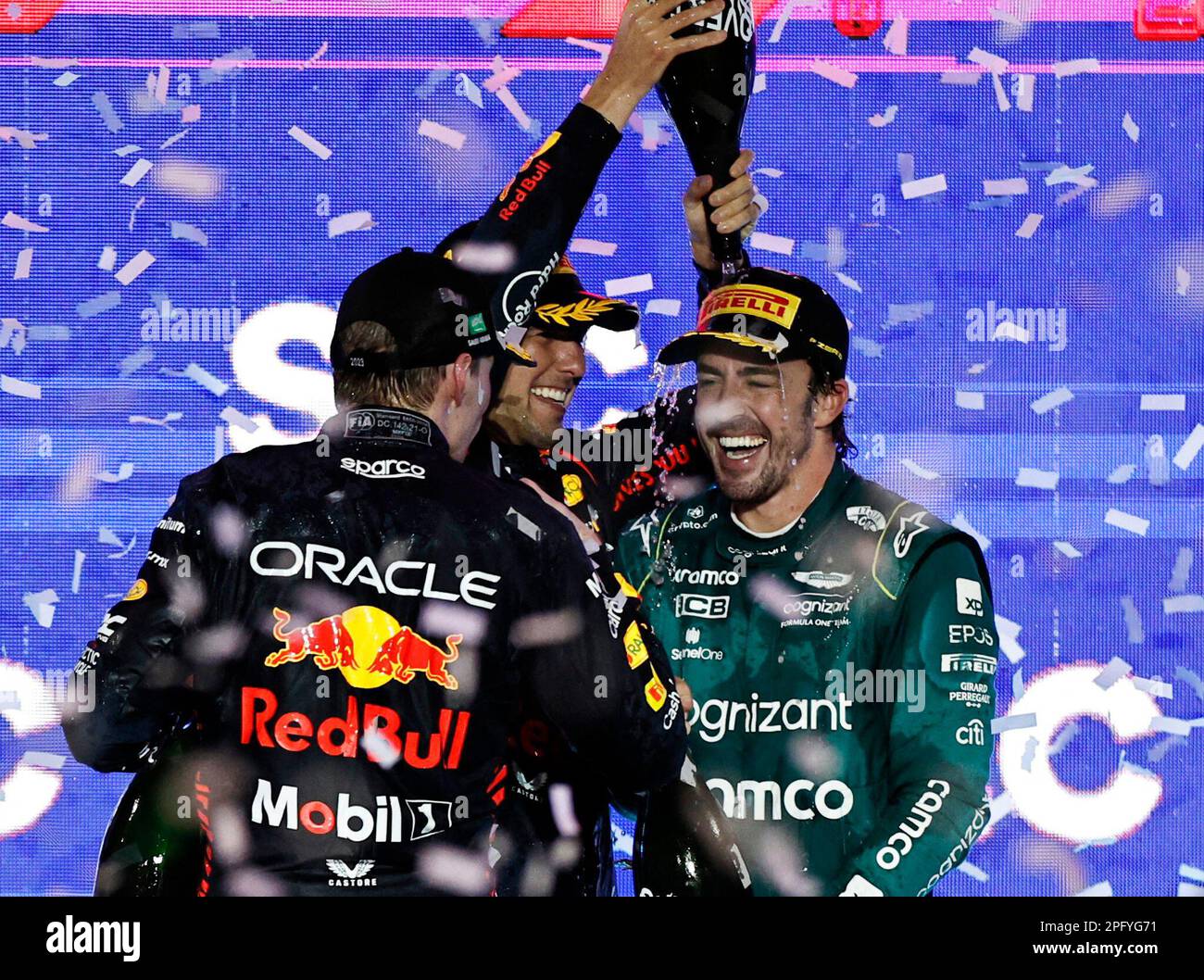 Formula One F1 - Saudi Arabian Grand Prix - Jeddah Corniche Circuit, Jeddah, Saudi Arabia - March 19, 2023 Aston Martin's Fernando Alonso celebrates on the podium after finishing third place in the Saudi Arabian Grand Prix with winner Red Bull's Sergio Perez and second placed Red Bull's Max Verstappen before he was handed a 10 second time penalty that drops him to fourth place in the final results REUTERS/Hamad I Mohammed Stock Photo