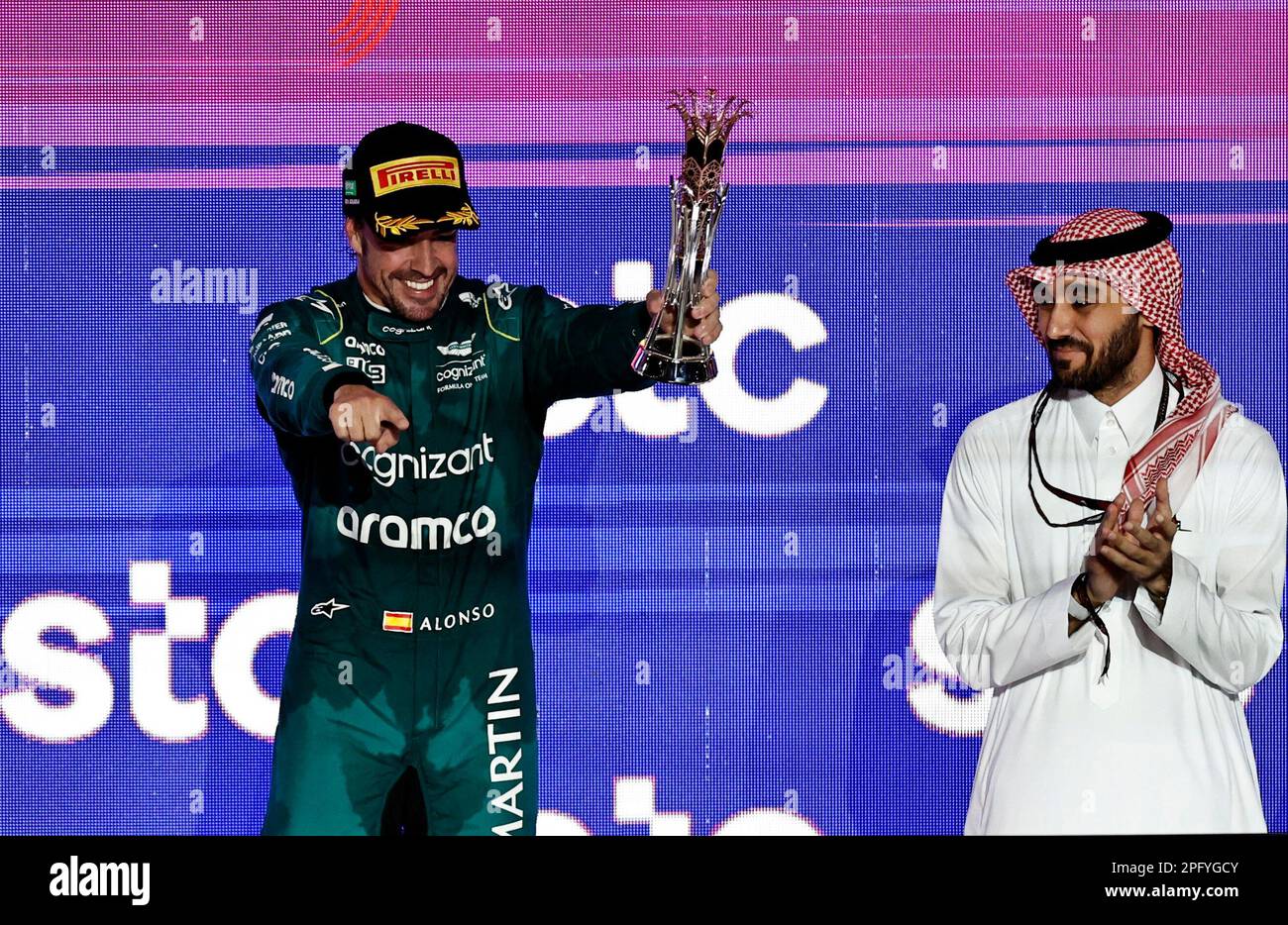 Formula One F1 - Saudi Arabian Grand Prix - Jeddah Corniche Circuit, Jeddah, Saudi Arabia - March 19, 2023 Aston Martin's Fernando Alonso celebrates with a trophy on the podium after finishing third place in the Saudi Arabian Grand Prix before he was handed a 10 second time penalty that drops him to fourth place in the final results REUTERS/Hamad I Mohammed Stock Photo