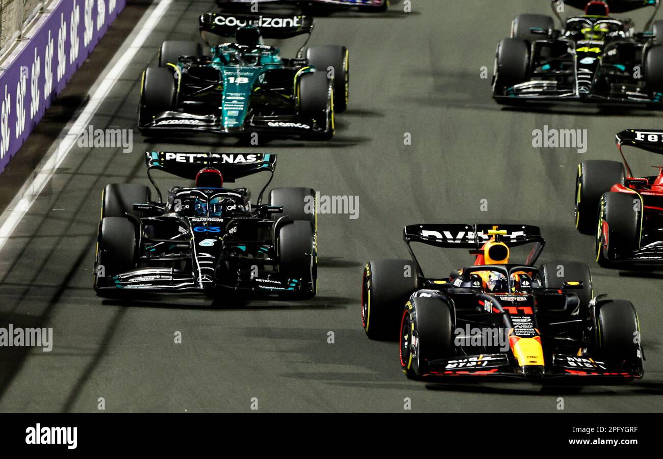 Formula One F1 - Saudi Arabian Grand Prix - Jeddah Corniche Circuit, Jeddah, Saudi Arabia - March 19, 2023 Red Bull's Sergio Perez and Mercedes' George Russell  in action during the race REUTERS/Hamad I Mohammed Stock Photo