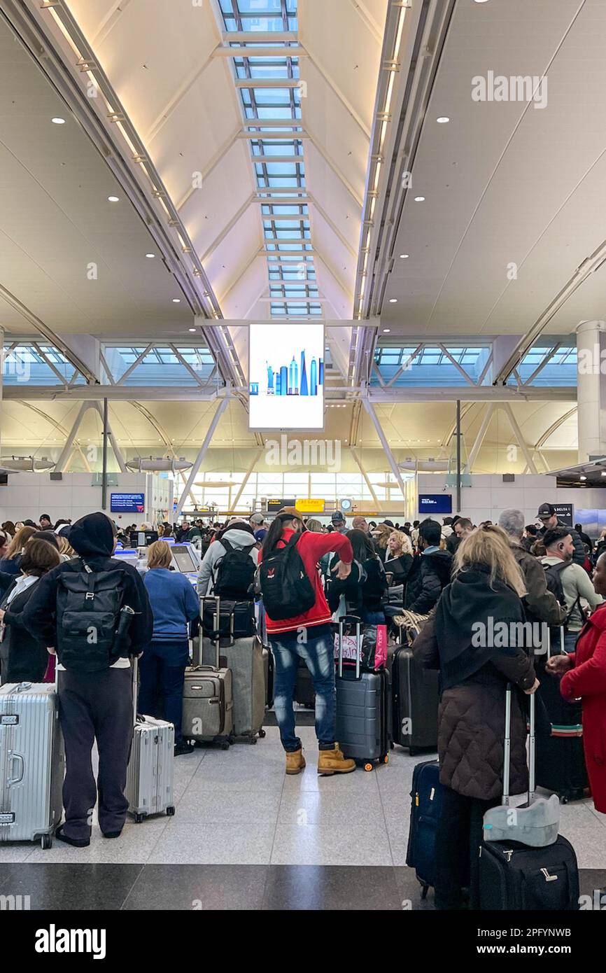 Queens, United States. 08th Mar, 2023. Passengers wait to check in and