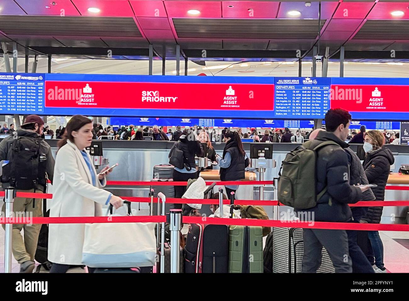 Queens, United States. 08th Mar, 2023. Passengers wait to check in and