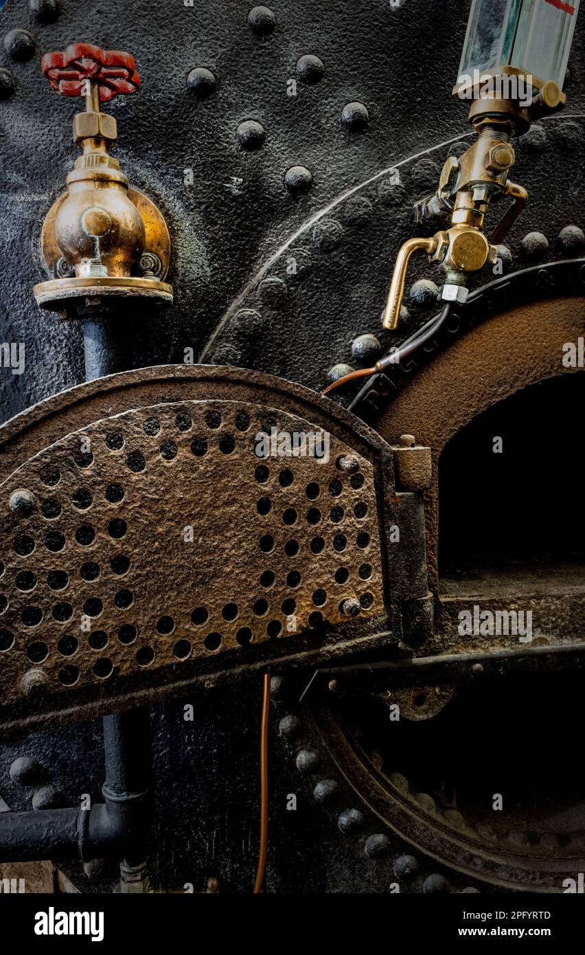 Heavy riveted steam boiler ( disused ) and regulator valves at Come