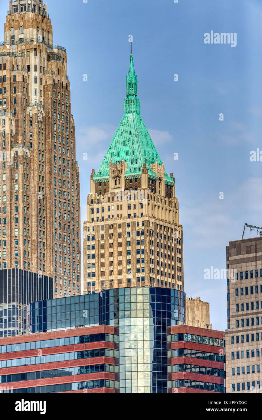 The verdigris pyramidal roof marks 40 Wall Street, The Trump Building. Stock Photo
