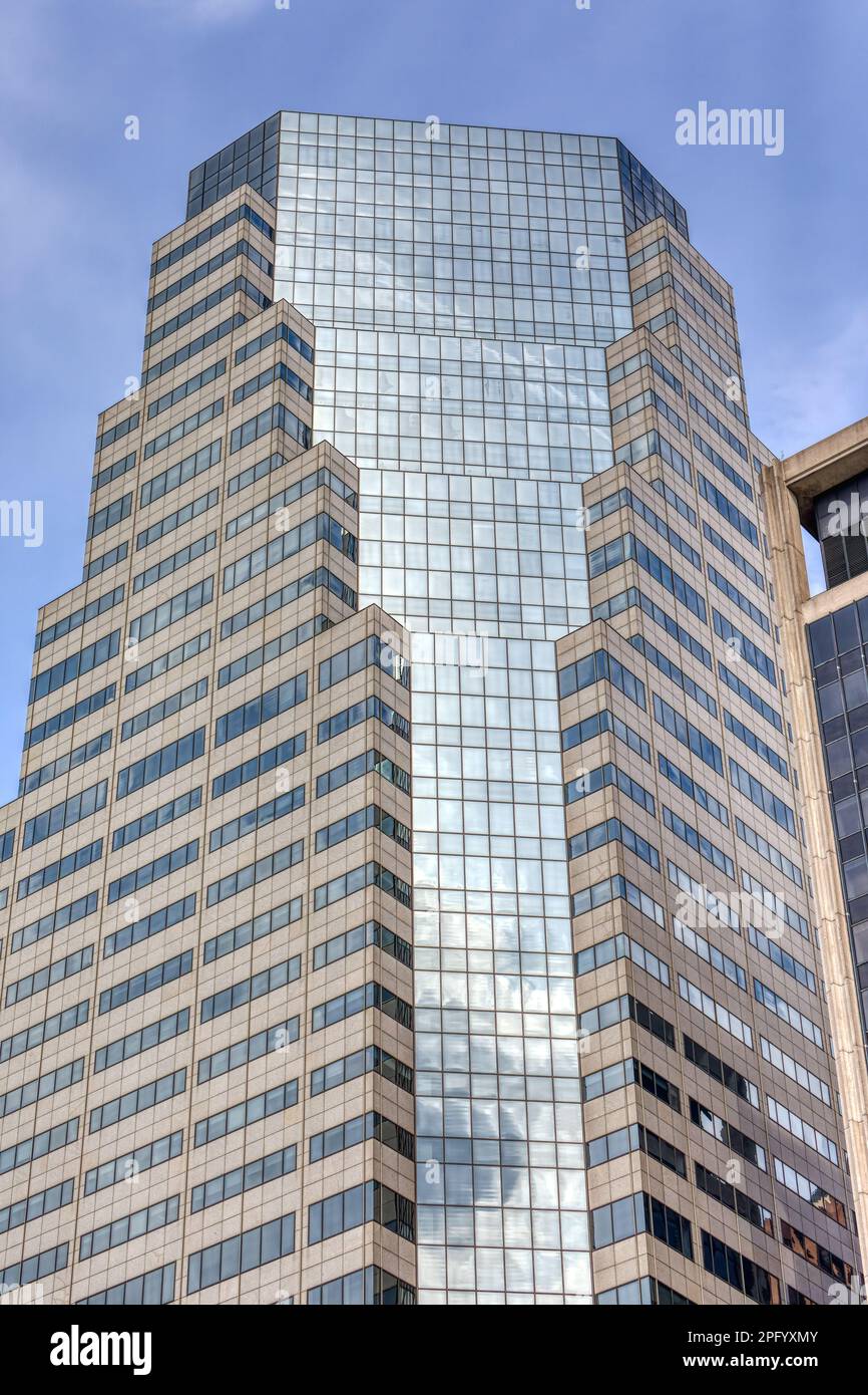 32 Old Slip, aka One Financial Square, has chamfered corners of reflective glass that broaden with every setback. Stock Photo