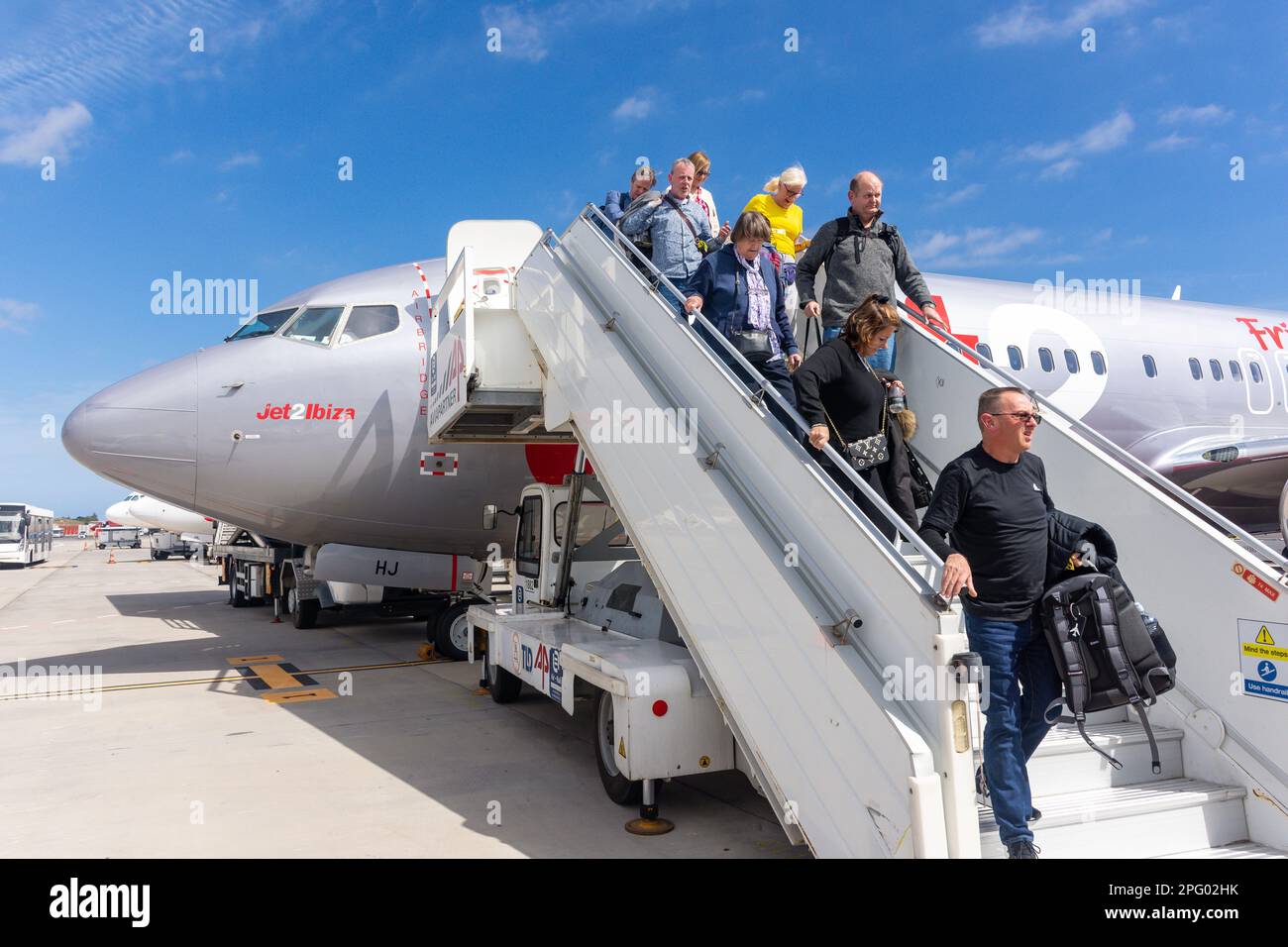 Passengers leaving Jet 2 Boeing 737-300 aircraft, Tenerife South Airport (Aeropuerto de Tenerife Sur), Tenerife, Canary Islands, Kingdom of Spain Stock Photo