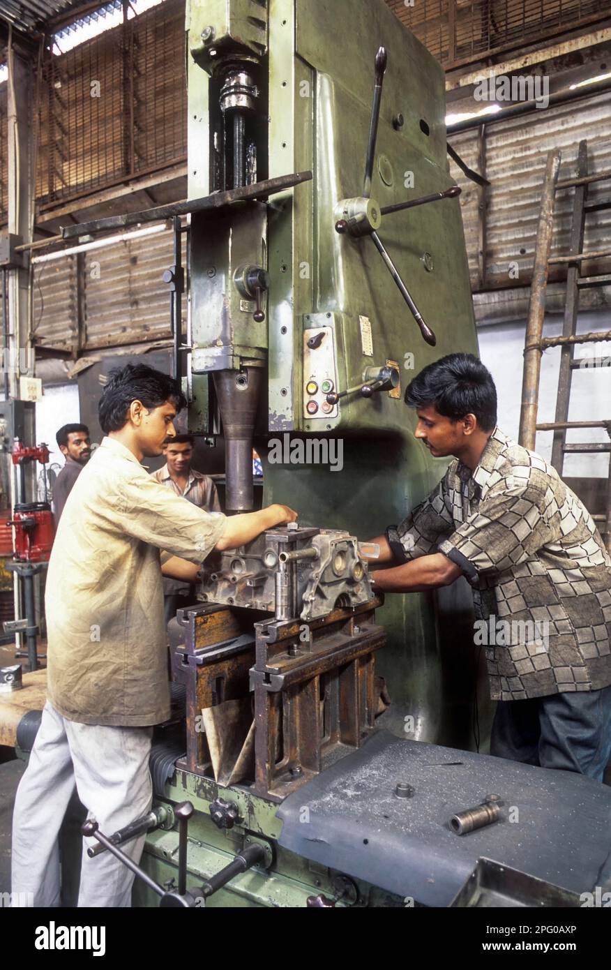 Machinist using metal lathe in Coimbatore, Tamil Nadu, India, Asia