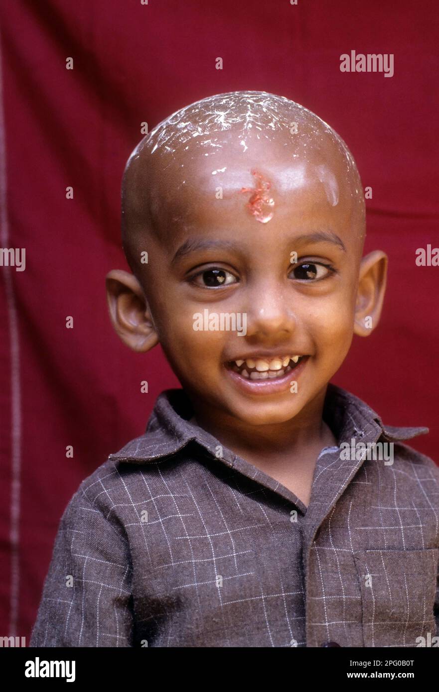 South Asia Indian boy smiling after his tonsure ceremony, Tamil Nadu, India, Asia Stock Photo
