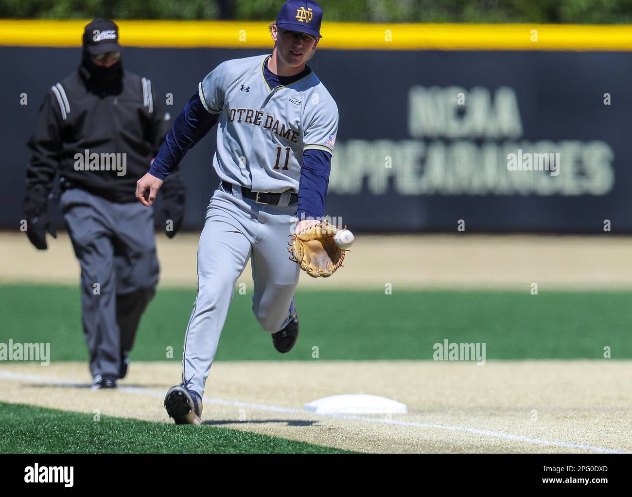 March 19, 2023: Notre Dame sophomore Jack Penney (11) fields ball at 3rd base. Notre Dame won 3-1 against #4 Wake Forest. NCAA baseball game between Notre Dame University and Wake Forest University at David F. Couch Ballpark, Winston Salem. North Carolina.David Beach/CSM Stock Photo