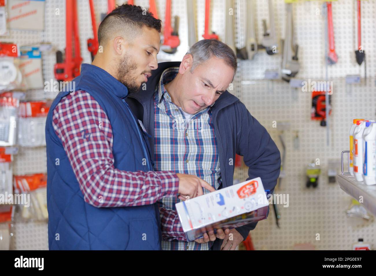 seller advising client in hardware store Stock Photo