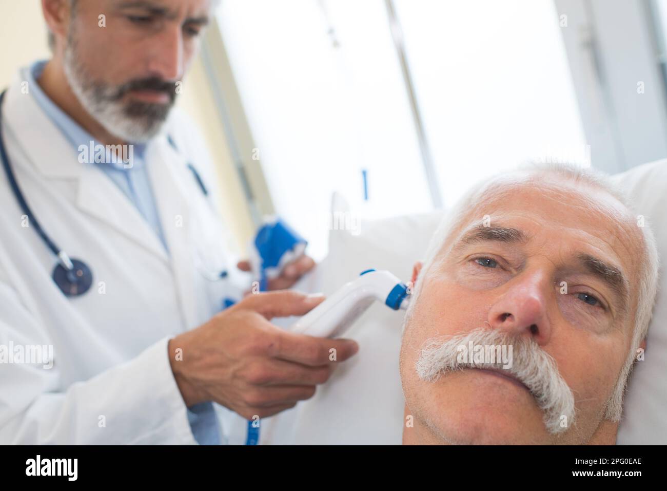 Doctor check patients ear hi-res stock photography and images - Alamy