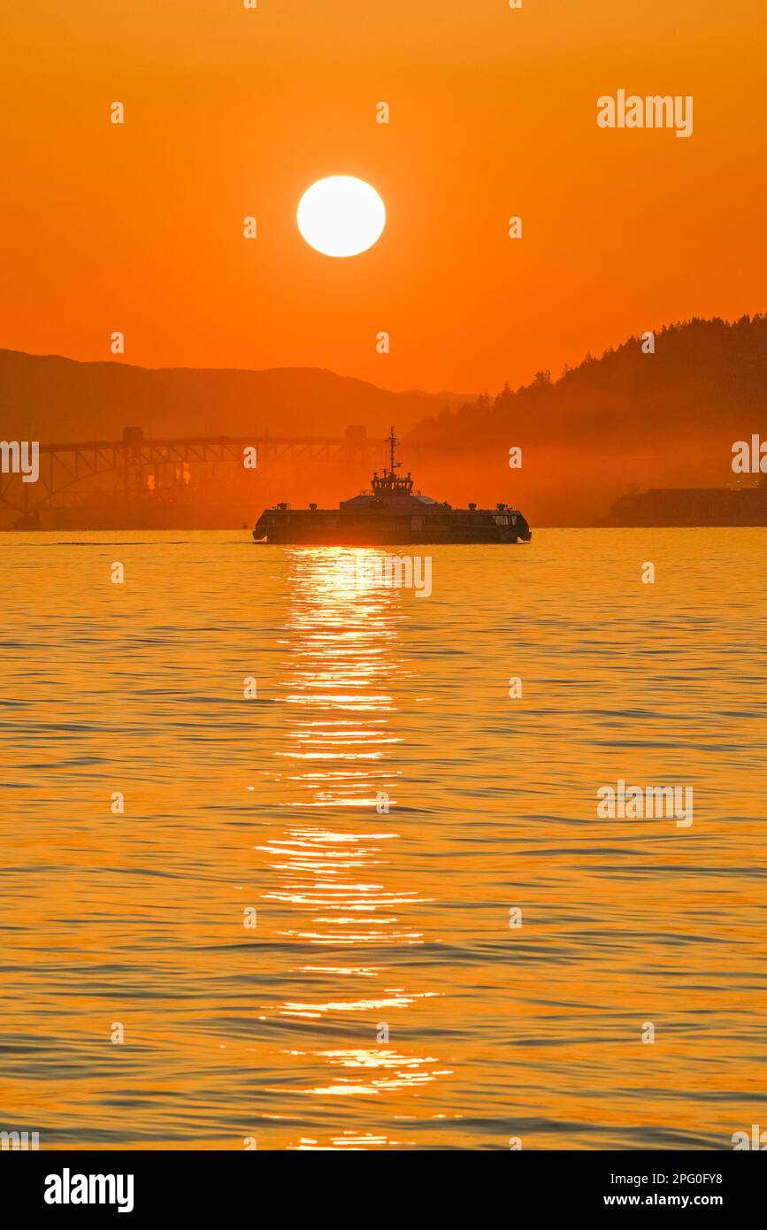 Seabus at sunrise, Burrard Inlet, Vancouver, British Columbia, Canada Stock Photo