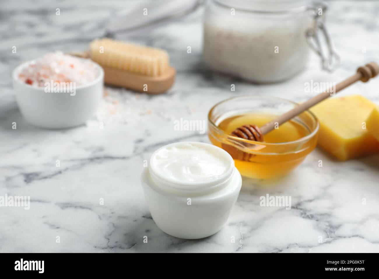 Cream with natural beeswax component on white marble table Stock Photo Alamy