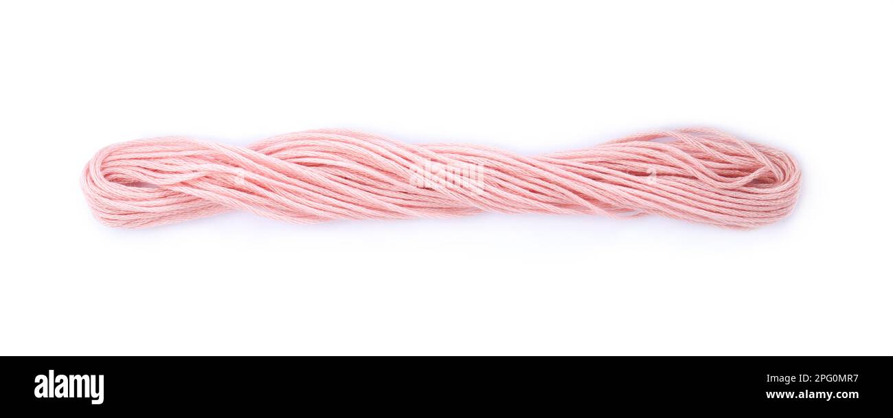 Bright pink embroidery thread on white background Stock Photo - Alamy