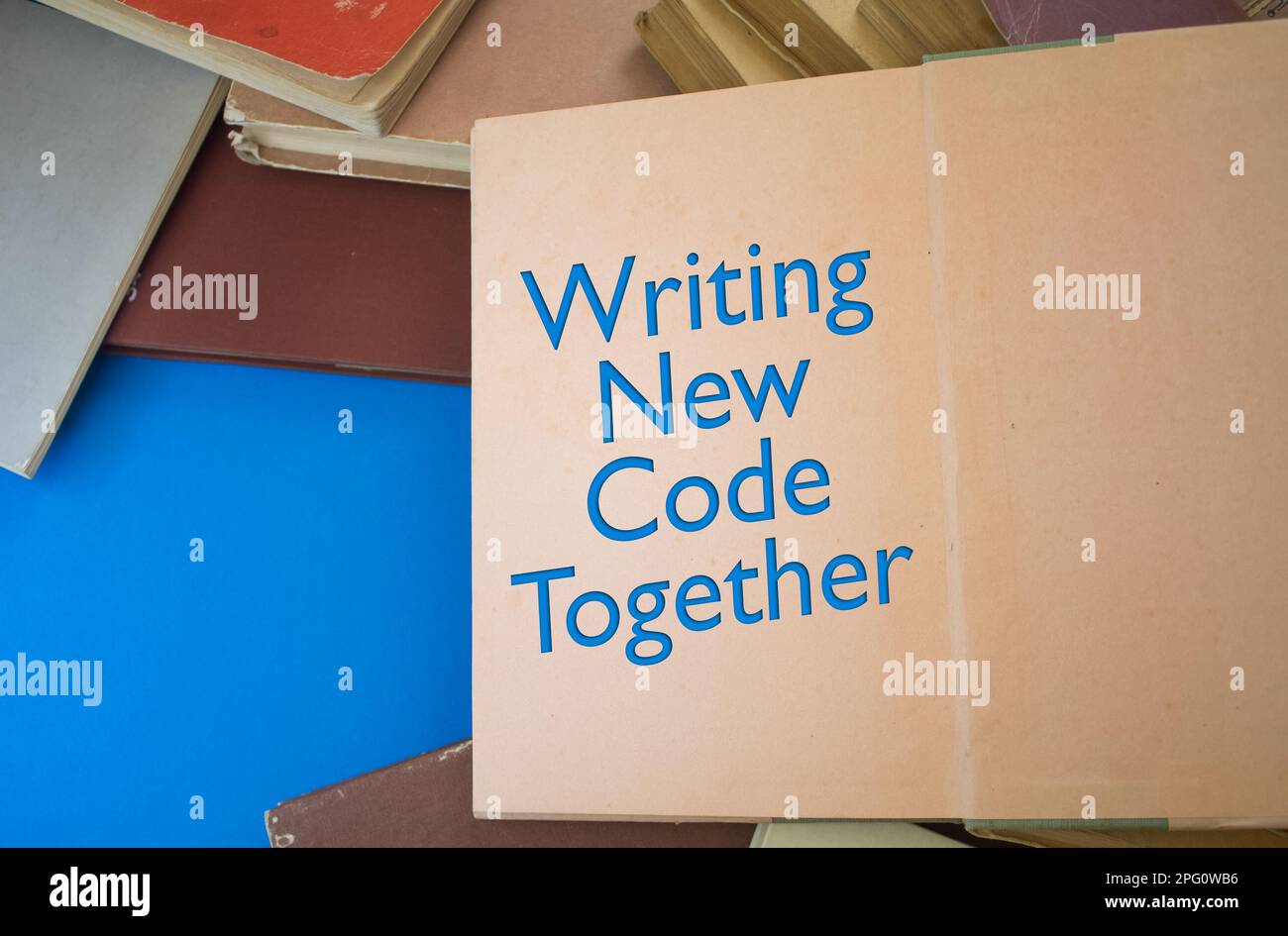 Writing New Code Together word in opened book with vintage, natural ...