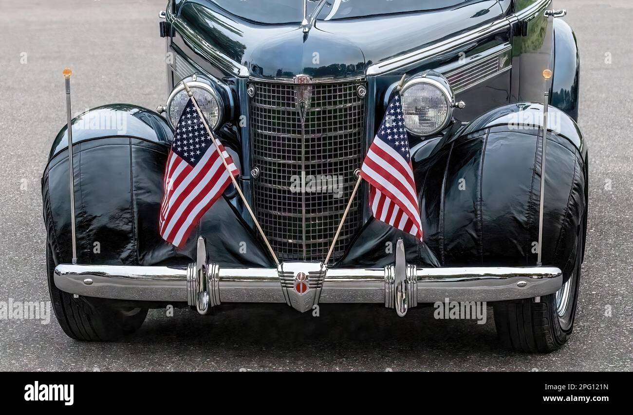 Front end grill and headlights with two American flags on a 1937